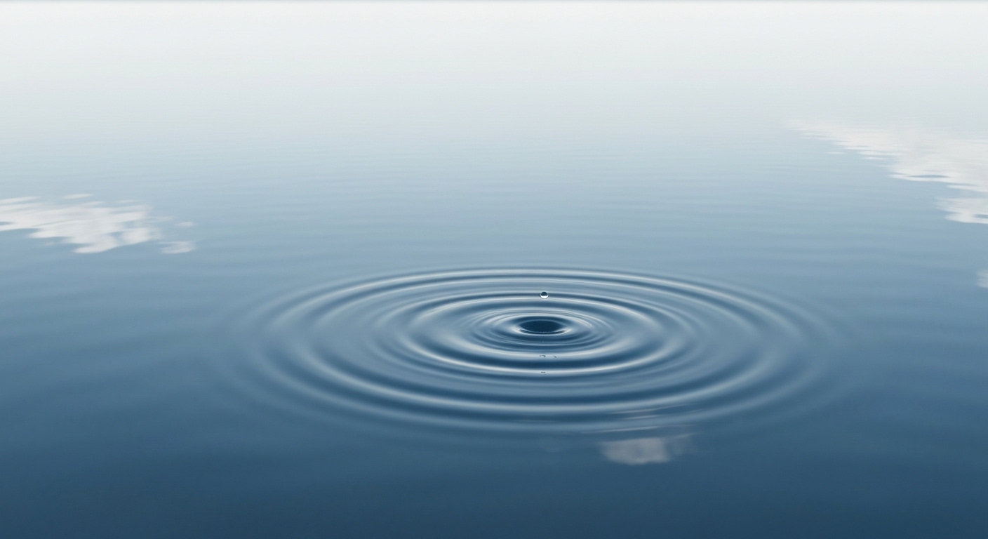A serene, minimalist abstract scene. A single, calm ripple expanding in a perfectly still, deep blue pool of water, reflecting a soft, unblemished light source from above, symbolizing mental clarity and space.